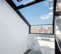 Glass roof terrace with city views