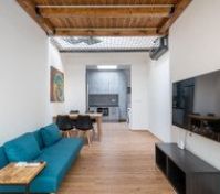 Living room sofa with kitchen view