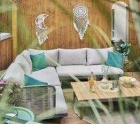 Terrace seating with boho wall decor