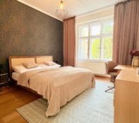 Spacious bedroom with desk