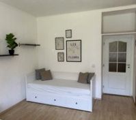White daybed with wall art
