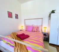 Colorful double bed with wardrobe